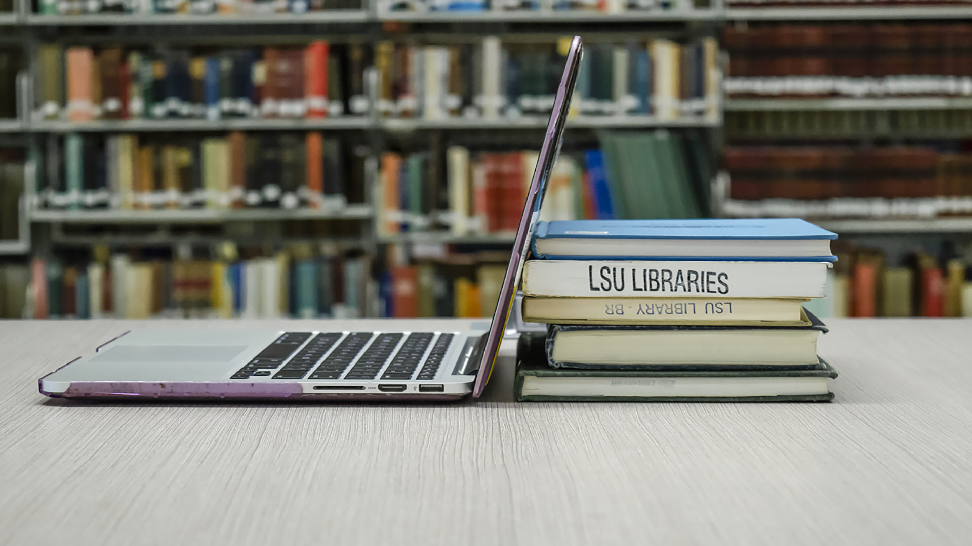 stack of books and laptop