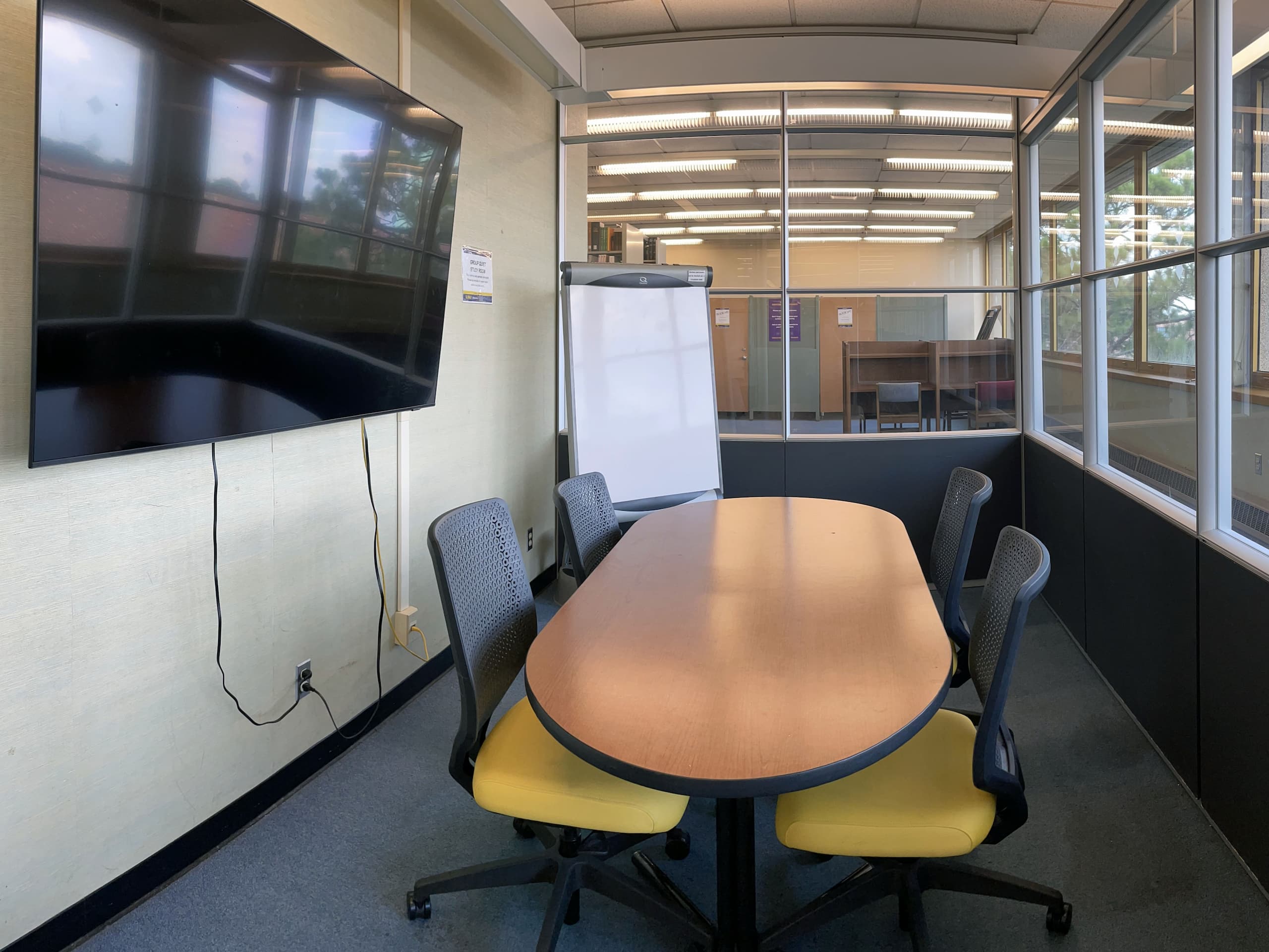 Quiet Study room with 4 chairs, display and whiteboard.