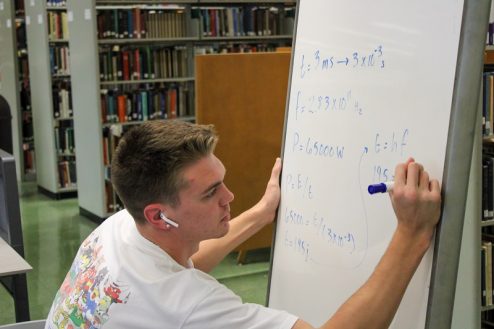 Student using whiteboard