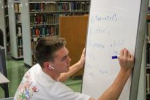 Student using whiteboard